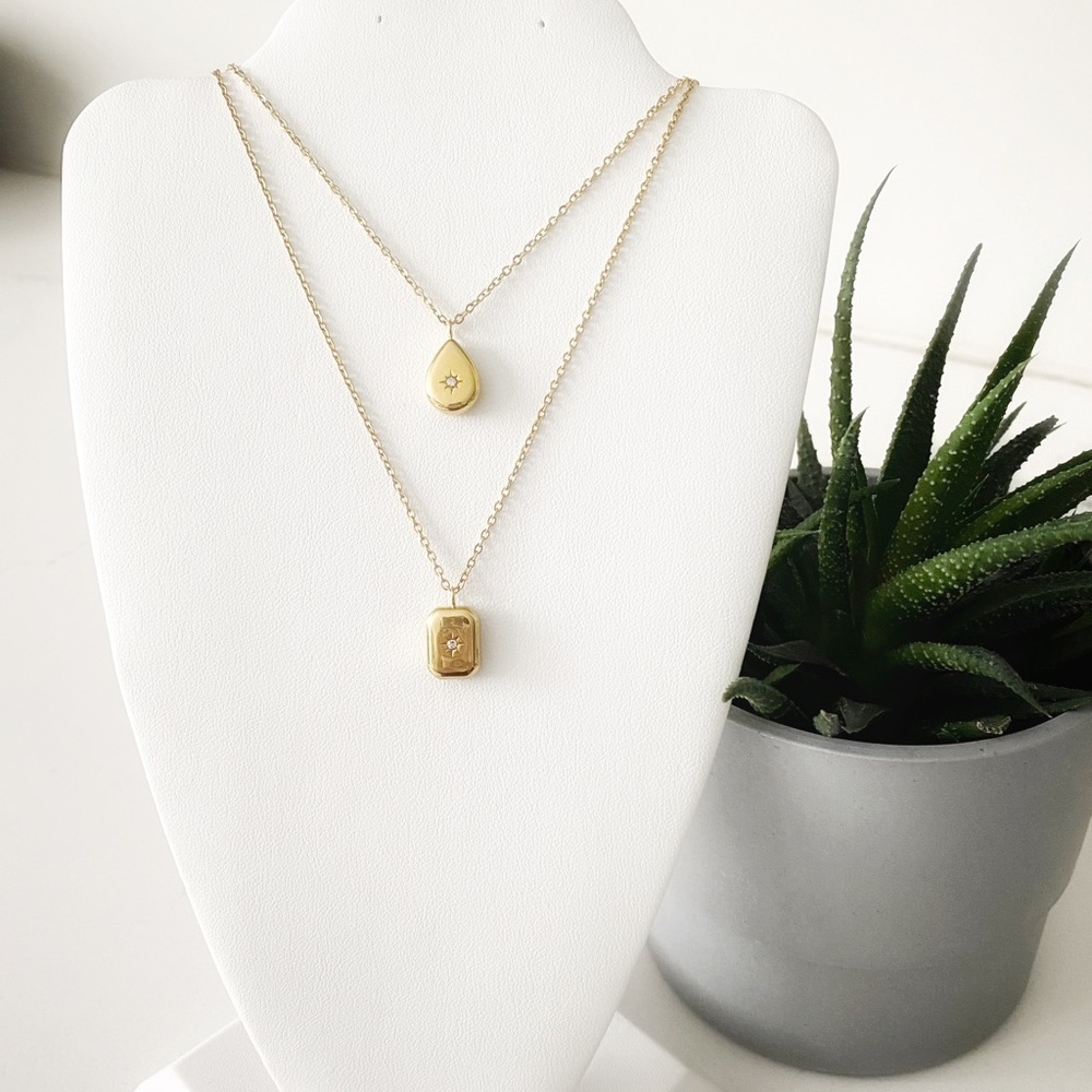 18k plated starburst pendant necklace. Zircon centre. Choose shape